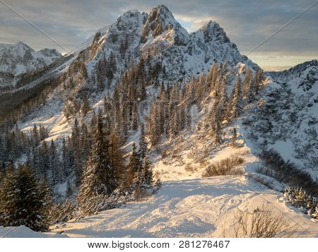 Spectacular Winter Mountain Landscape Illuminated By Setting Sun.