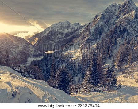 Spectacular Winter Mountain Landscape Illuminated By Setting Sun.