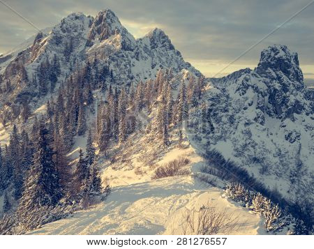 Spectacular Winter Mountain Landscape Illuminated By Setting Sun.