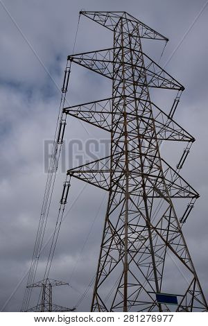 A Power Line Pole  Against Hazzy Sky