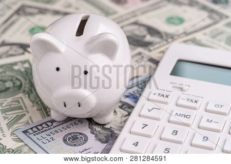 Accounting, Finanacial Investment Or Budget Concept, Cute White Piggy Bank Or Coin Bank And Calculat