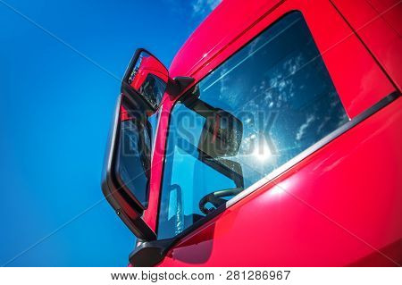 Red Modern Semi Truck Cabin Closeup. Trucking Industry. Cdl Concept.