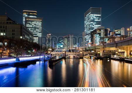 Osaka Skyscraper Building In Nakanoshima District At Night In Osaka, Japan