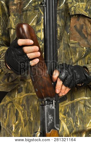 Hands Of The Hunter Separate The Handguard From The Shotgun