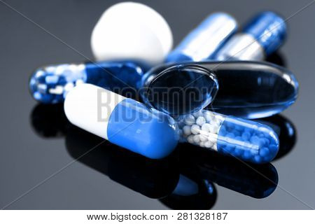 Colorful Of Oral Medications On Dark Background. Capsule And Tablet Oral Dosage Form.