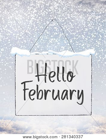 Hello February Text On White Plate Board Banner With Cold Snow Flakes Qoute