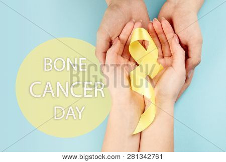 Yellow Ribbon Symbolic Color For Sarcoma Bone Cancer Awareness And Suicide Prevention On Aged Wood W