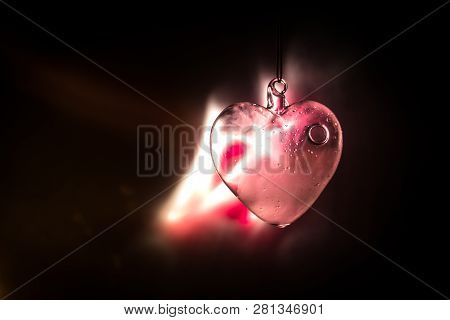 Valentines Day Concept. Glass Transparent Heart On Dark. Crystal Heart In The Dark, Glass Heart Glow
