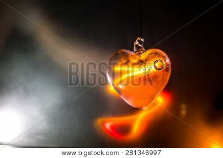 Valentines Day Concept. Glass Transparent Heart On Dark. Crystal Heart In The Dark, Glass Heart Glow