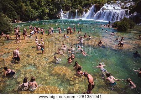 Krka National Park, Croatia - Aug 13, 2015: Plenty Of Tourists Enjoy Swimin In Krka Waterfalls In Th