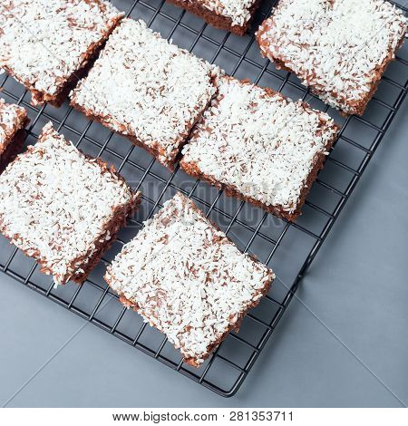 Homemade Brownie With Coconut Flakes, Swedish Dessert Karleksmums, Cut In Square Servings, On A Cool