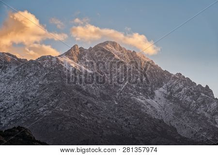 Snow Capped Peak Of Monte Grosso Mountain In Corsica