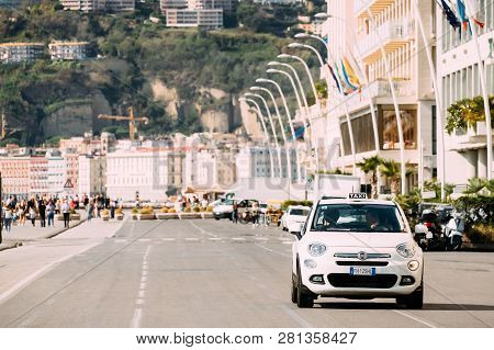 Naples, Italy - October 17, 2018: Fiat 500x Type 334 Taxi Car Moving In Via Partenope Street. Subcom