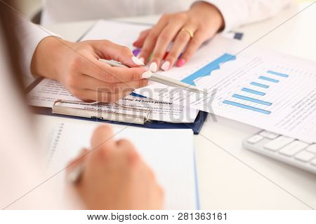 Businesswoman Holding A Silvery Pen In Her Hand Indicates The Interlocutor For A Digram On The Form 
