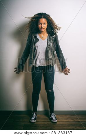 Portrait of a mixed race pretty teenage girl in the studio