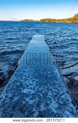 Jetty Full Of Ice In A Lake