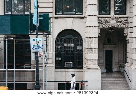 New York - June 1, 2018: African American Man Walking By Nypd Cameras Sign In Manhattan, New York. N