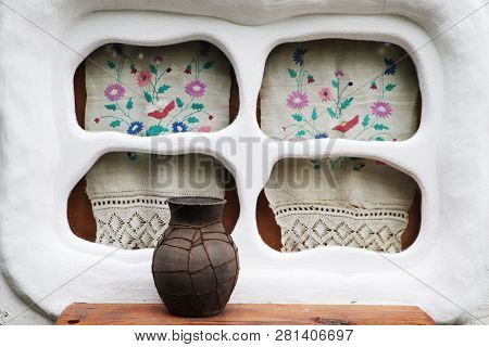 Old Window In The Ukrainian Village. Embroidery And Glechik On The Window