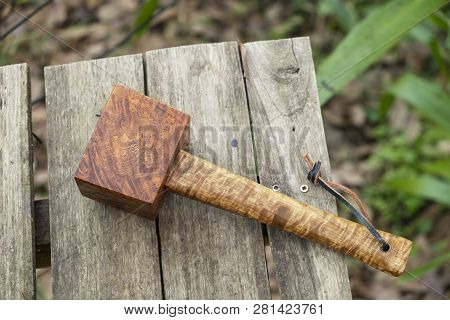 Mallet Hammer Made Of Burl Wood Tools For Used By Carpenter In Workshop On Isolated Blurred Backgrou