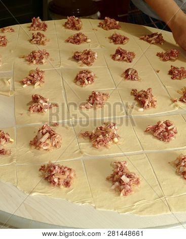 Kyrgyz Ravioli, A Woman Doing Ravioli, Meat Ravioli, Pasty Woman Who.make Ravioli With Dough.