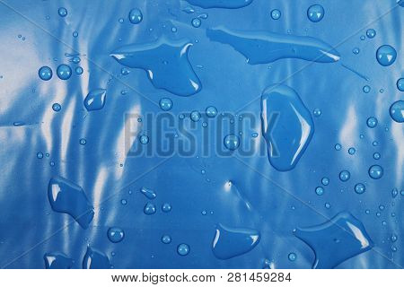Blue Texture Of Plastic (latex) With Reflections And Bubbles, Similar To The Sea Texture. Background