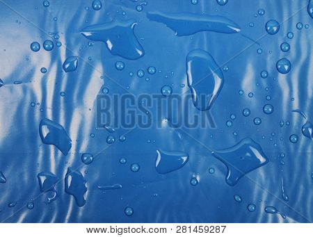 Blue Texture Of Plastic (latex) With Reflections And Bubbles, Similar To The Sea Texture. Background