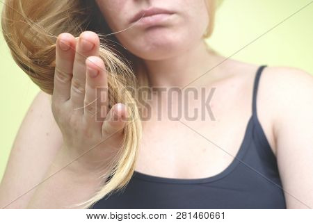 Damaged Hair. Beautiful Sad Young Woman With Long Disheveled Hair. Hair Damage, Health And Beauty Co