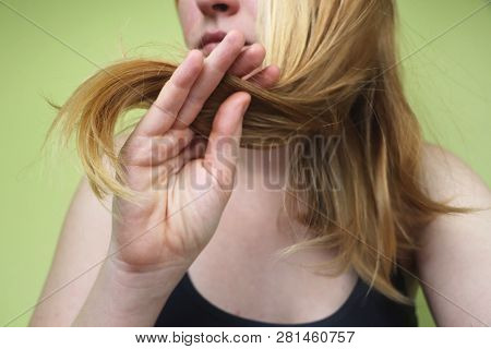 Damaged Hair. Beautiful Sad Young Woman With Long Disheveled Hair. Hair Damage, Health And Beauty Co