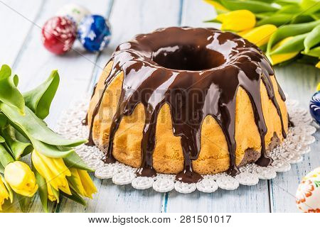 Delicious Holiday Slovak And Czech Cake Babovka With Chocolate Glaze. Easter Decorations - Spring Tu