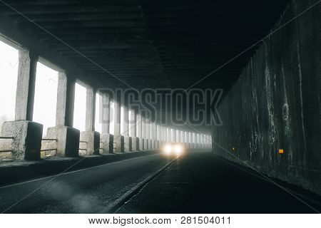 On A Foggy Road Along Nature With A Limited View. Rood In Fog.