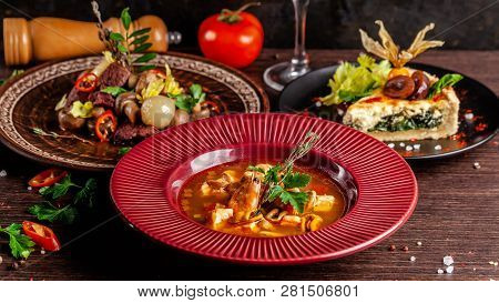 Concept Of French Cuisine. Laid Table In A Restaurant For A Celebration Of Different Dishes. Backgro
