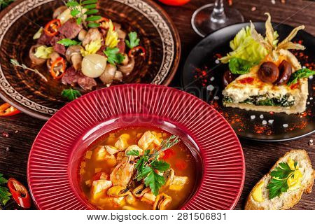 Concept Of French Cuisine. Laid Table In A Restaurant For A Celebration Of Different Dishes. Backgro