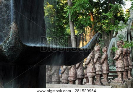 Chinese Dragons, Statues Of Ronin And Fountains At Sunset