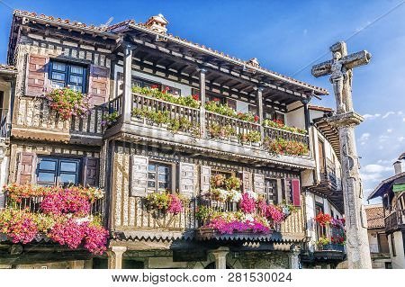 Stone Cross And Typical Architecture In Main Square Of La Alberca.spain