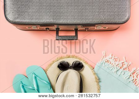 Suitcase With Female Outfit For Beach On Pink. Top View With Copy Space. Summer Tropical Vacatons.