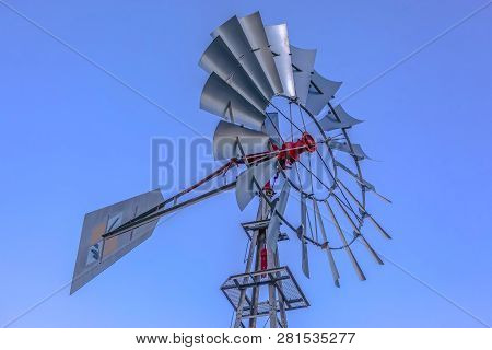 Multi Bladed Windpump Against Blue Sky In Utah