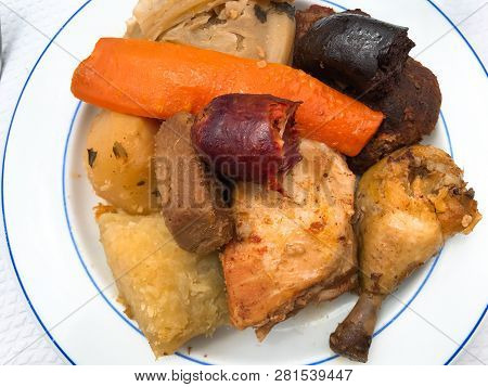 Stew Typical Of The Island Of São Miguel In Azores With Chicken, Chorizo Sausage, Carrot, Cabbage, P