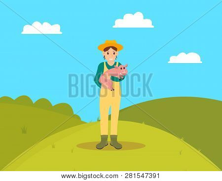 Farmer With Piglet Standing On Hill. Grass And Bushes, Farming In Nature Greenery Surrounding. Swine
