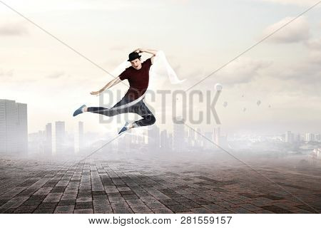 Dance is his world . Mixed media