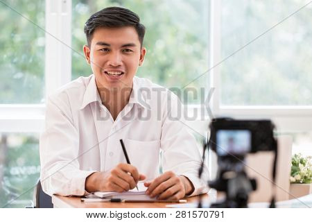 Happy Asian Businessman Videoblog / Blogger Vlogger Recording Online Course Or Tutorial Strategy Pre
