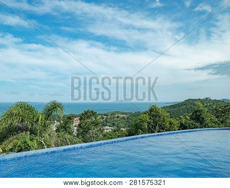 Pool On The Edge Of A Hill With A View To The Sea. Infinity Pool. Ilha Do Arvoredo Island On Backgro