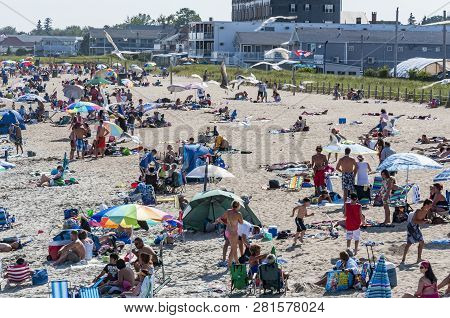 Old Orchard Beach, Maine - August 26: People Enjoy The Beach In Old Orchard Beach, Which Since 1898 