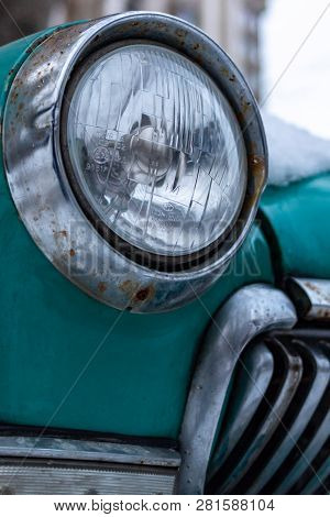 Old Soviet Car Volga. Turquoise Retro Car Covered With Snow. Gaz-21 On The Street In Winter.