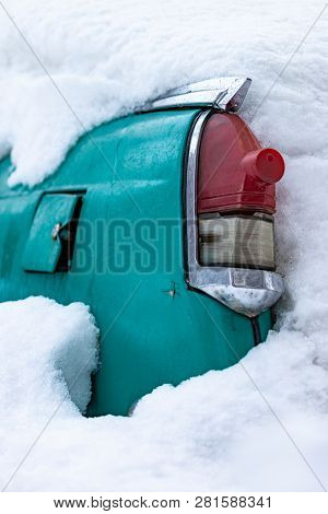 Old Soviet Car Volga. Turquoise Retro Car Covered With Snow. Gaz-21 On The Street In Winter.