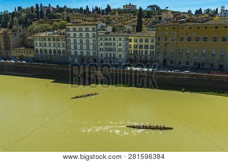 Florence, Italy - April 7, 2018: Unidentified Members Of Florence Rowing Club Training On Arno River