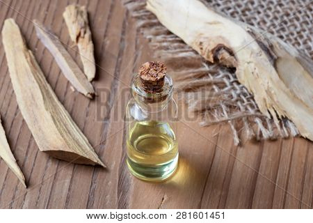 A Bottle Of Essential Oil With White Sandalwood