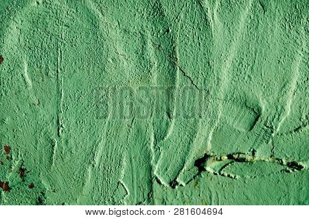 closeup of a rustic green plastered wall to be used as a background