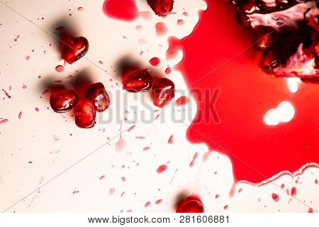 Closeup View Of Grain Red Grenades. Juicy Ripe Red Granets Or Garnets. Fruits Of Red Ripe Pomegranat