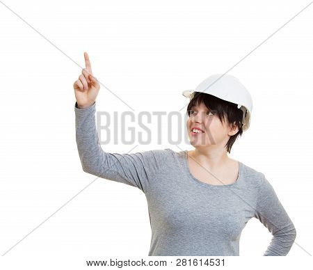 Positive Young Woman Engineer Wearing Protective Helmet Pointing Index Finger Up Isolated Over White