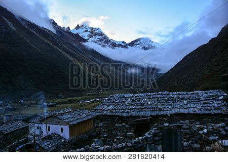 Beautiful Evening View Of Himalayan Ridge From Khambachen At Dusk. Traditional Nepalese Stone Houses
